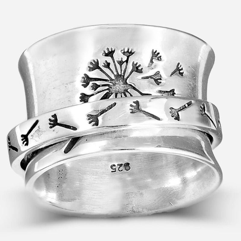 Anillo giratorio de diente de león