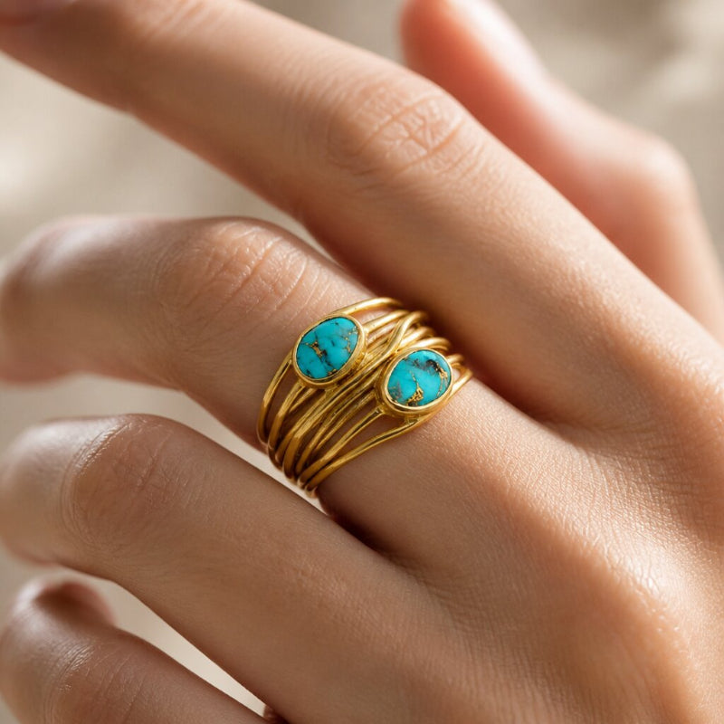 Anillo envolvente dorado con turquesa