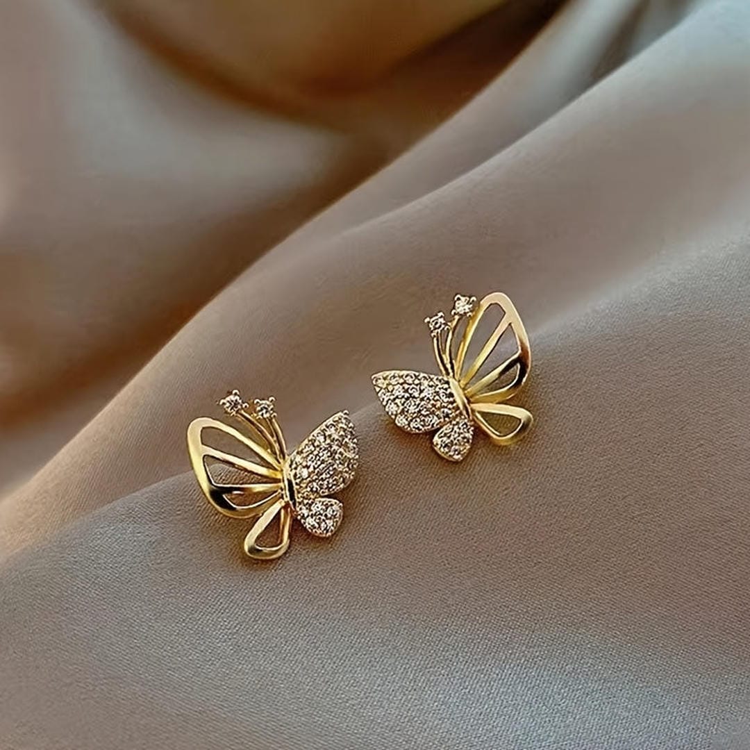 Pendientes de mariposa con pavé en tono oro
