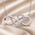 Collar con colgante de corazón infinito en oro blanco