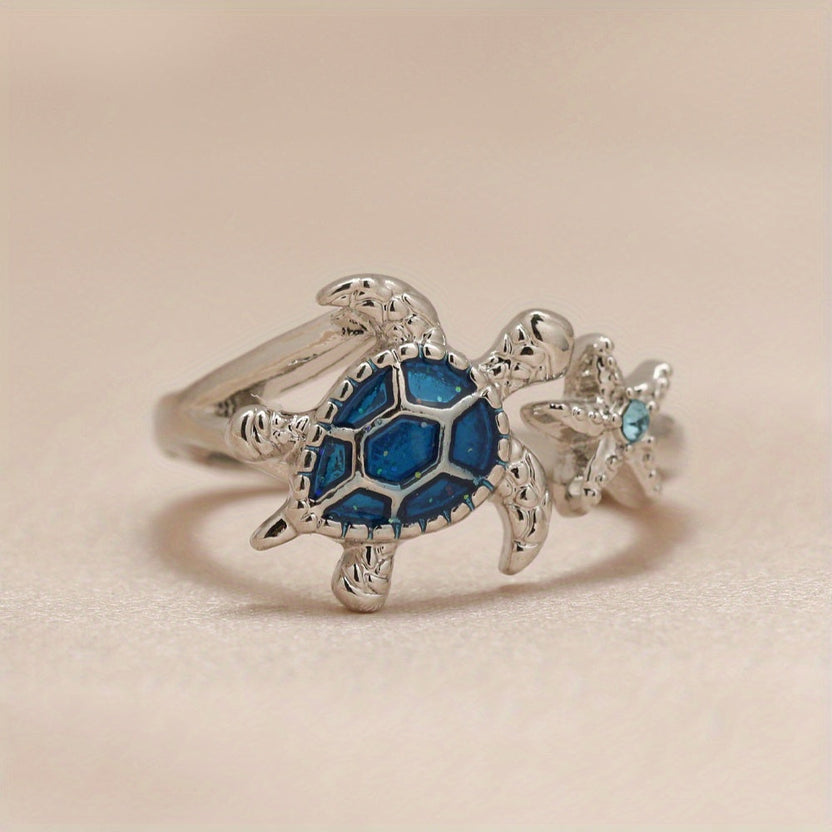 Anillo de tortuga marina y estrella de mar azul