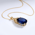 Collar de topacio azul y oro