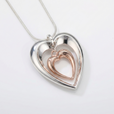 Collar de doble corazón en plata y oro