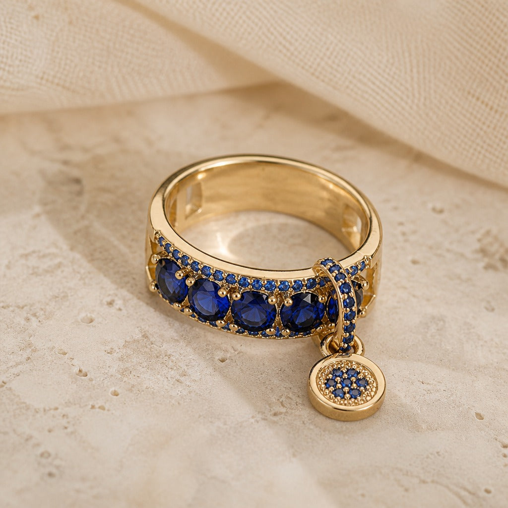 Anillo dorado llamativo con cristal azul – imagen 2