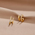 Pendientes Claw dorados con cristal