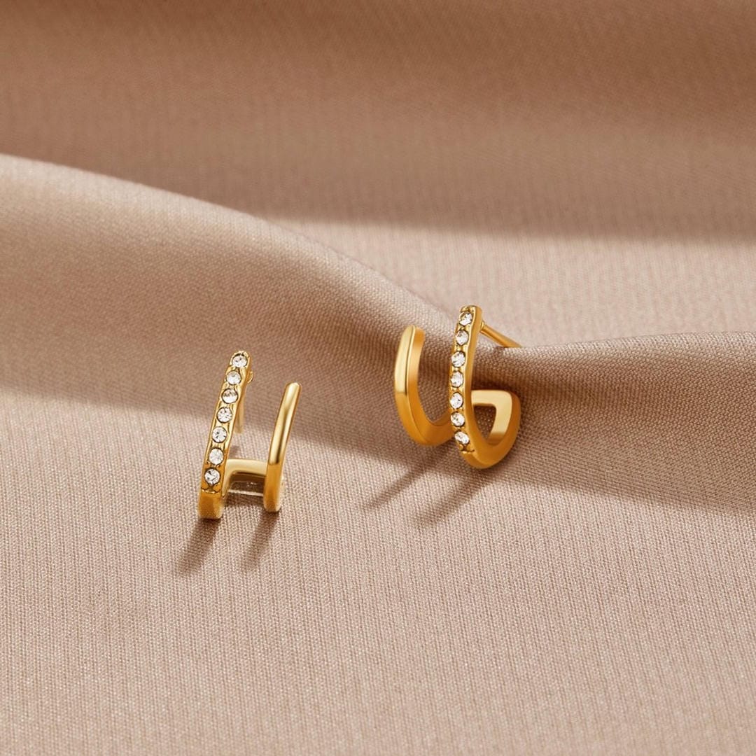 Pendientes Claw dorados con cristal