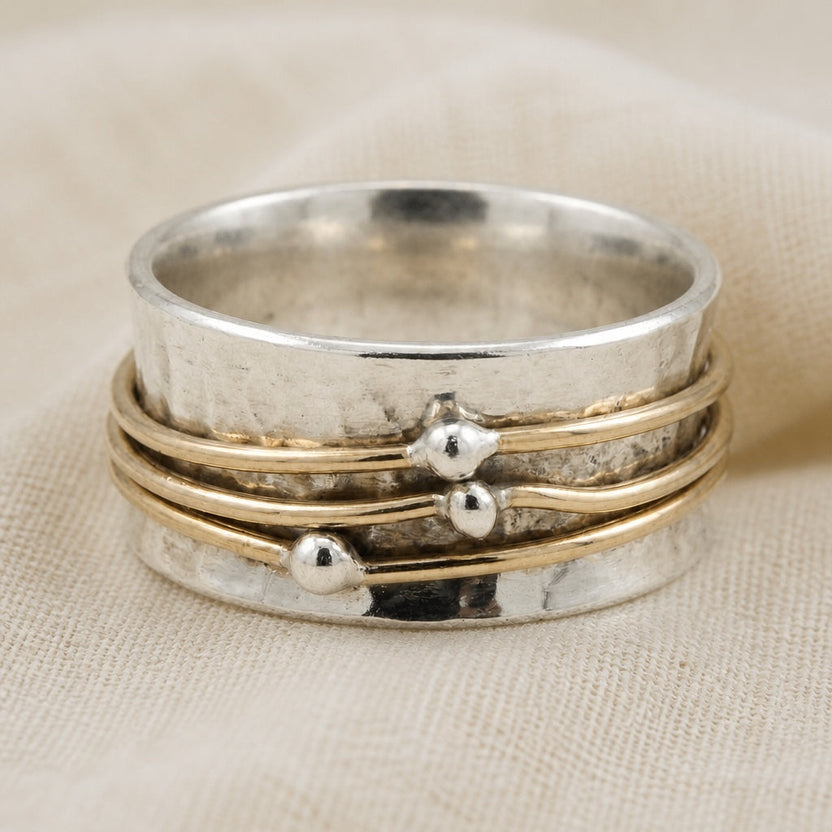Anillo giratorio de dos tonos