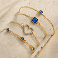 Set de pulseras de zafiro con corazones dorados – imagen 2