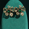 Pendientes dorados de mariposa esmeralda con cristal