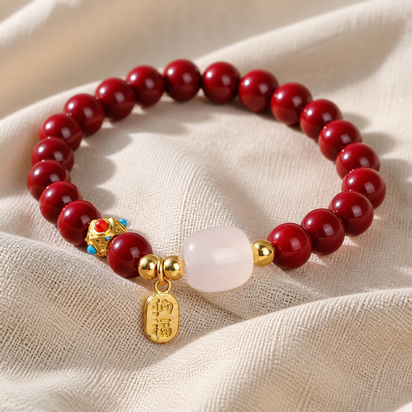 Pulsera de jade cinabrio con dije dorado