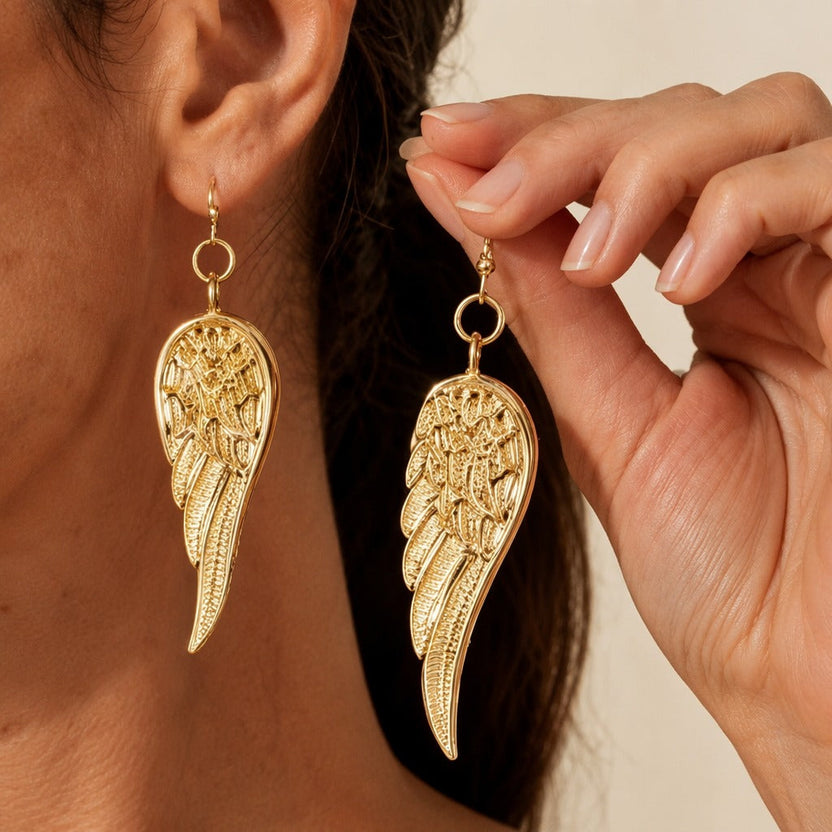Pendientes con alas de pluma divinas