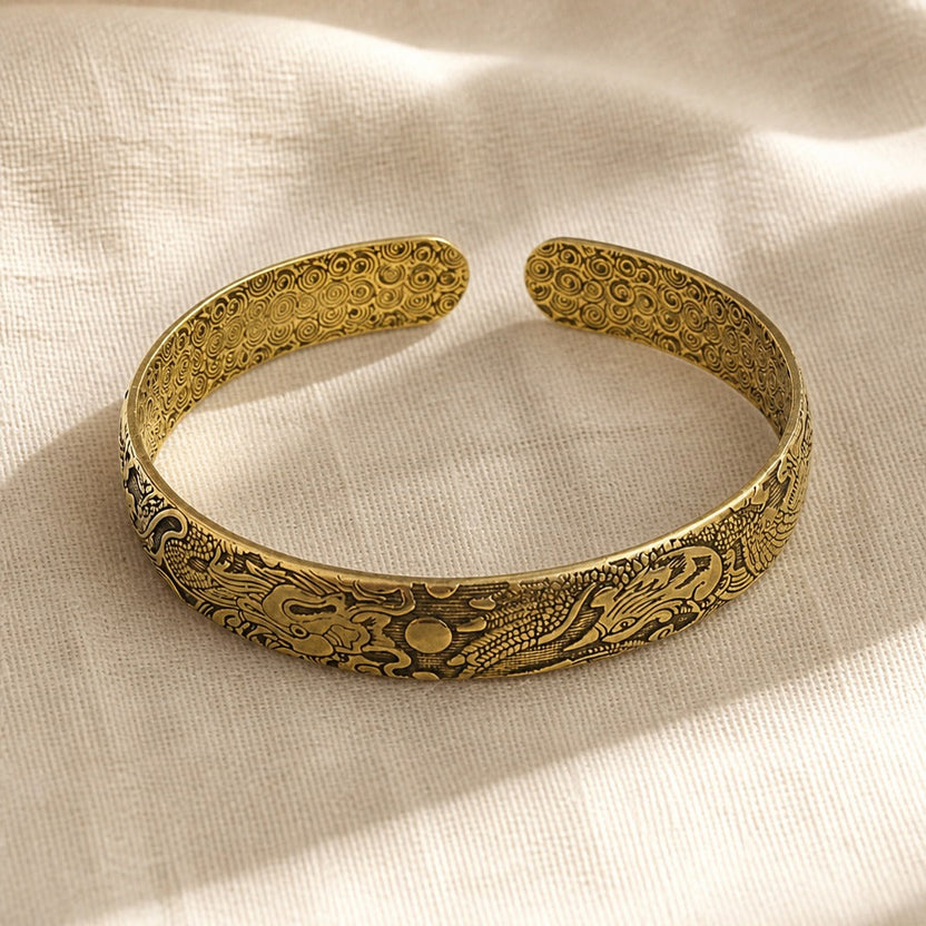 Brazalete antiguo de dragón y fénix