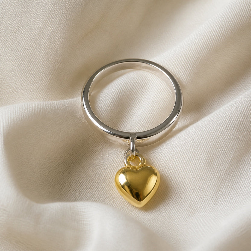 Anillo de plata con corazón colgante