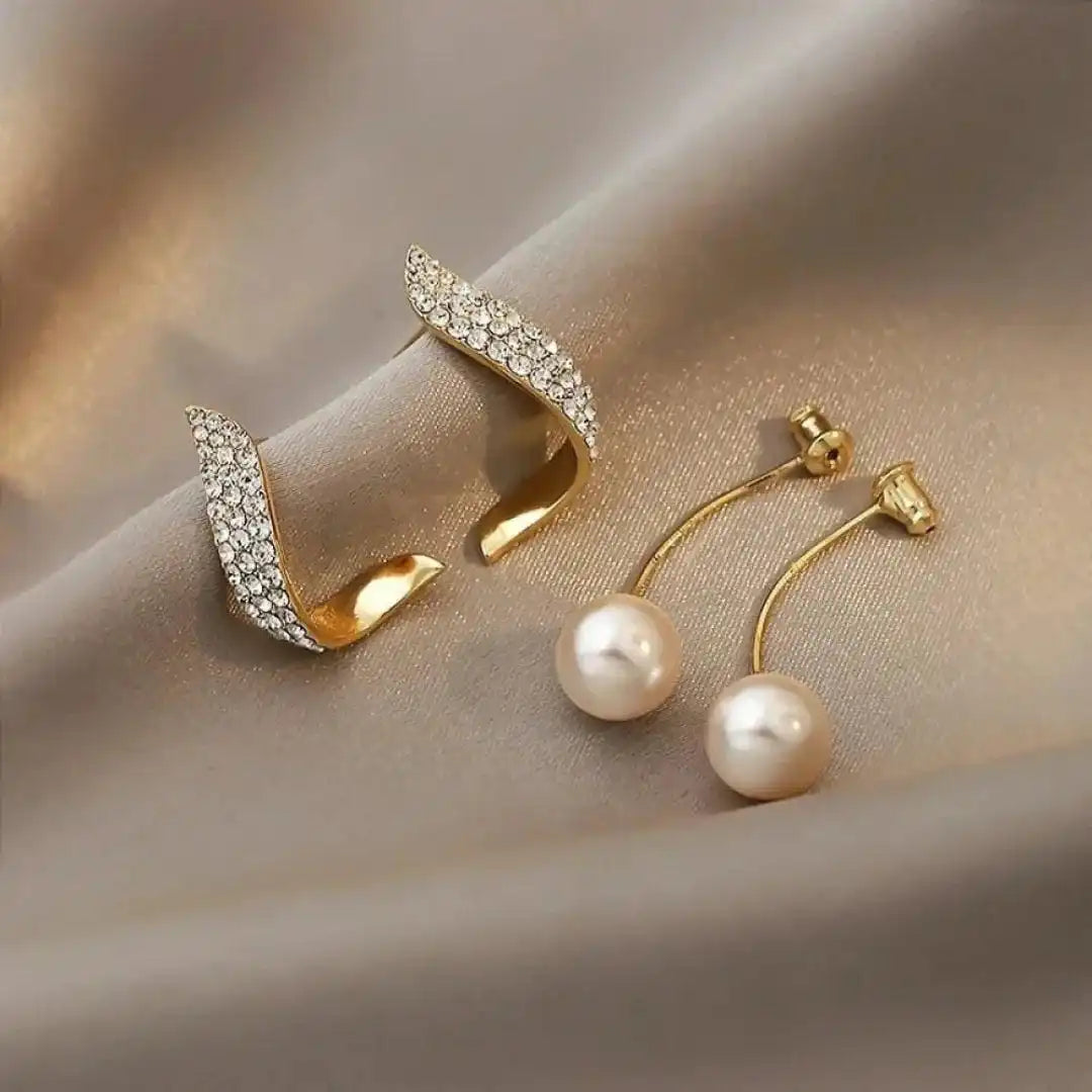 Pendientes elegantes de perla en gota dorados