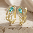 Pendientes bohemios dorados de hoja turquesa