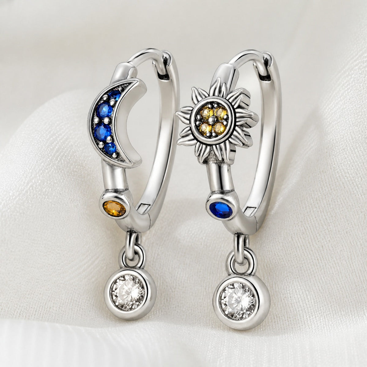 Pendientes opulentos con dije de zafiro