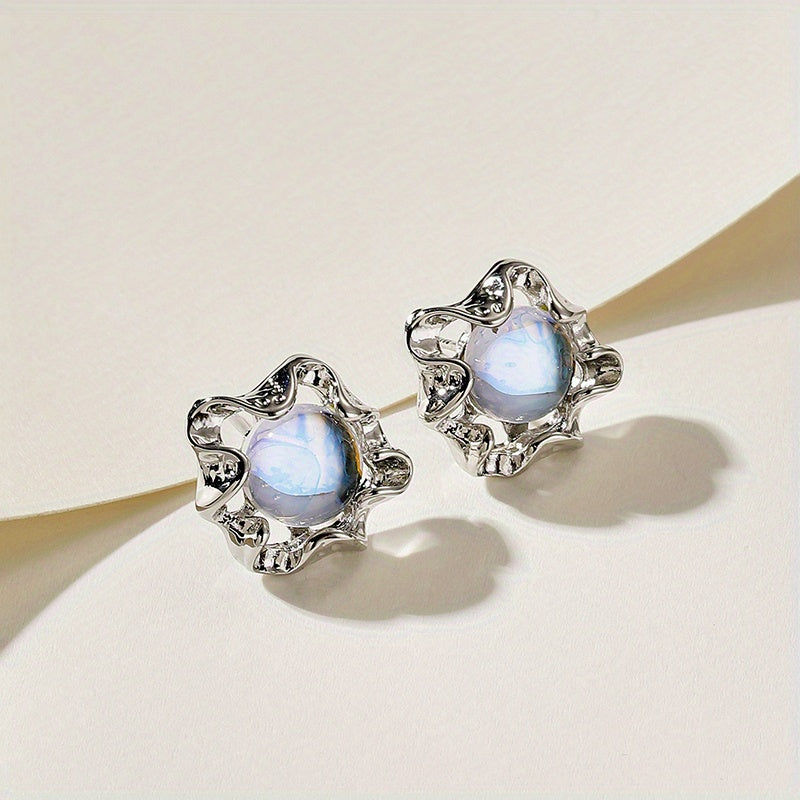 Pendientes ondulados de plata con estrella de piedra luna