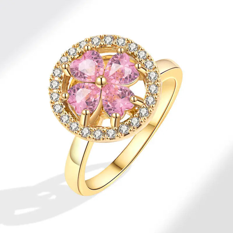 Anillo giratorio de flor dorada