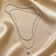 Collar con colgante de doble capa en forma de lágrima en oro blanco