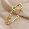 Pulsera de dijes en oro con esmeralda – imagen 3