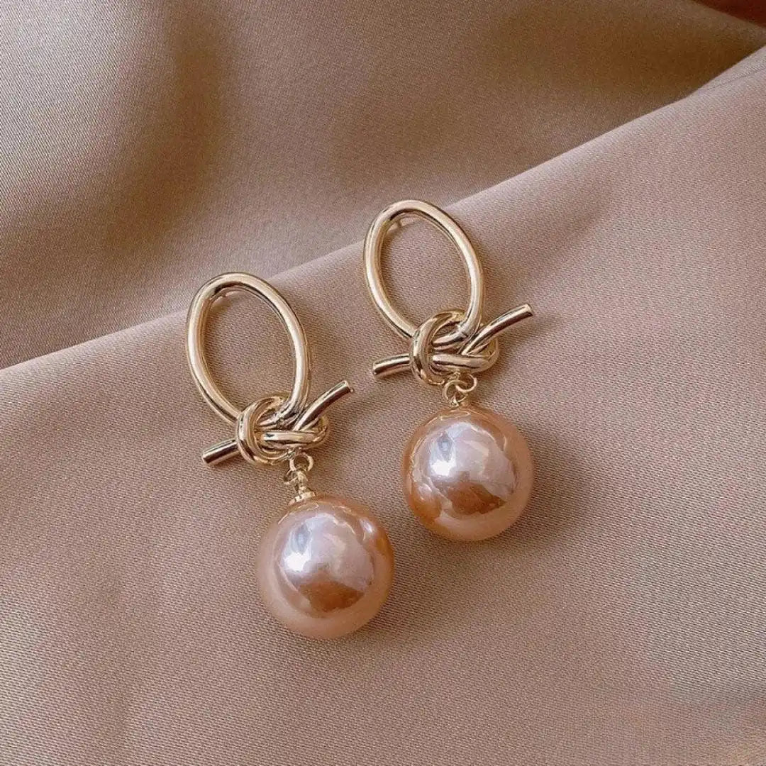 Pendientes elegantes colgantes de perla rosa