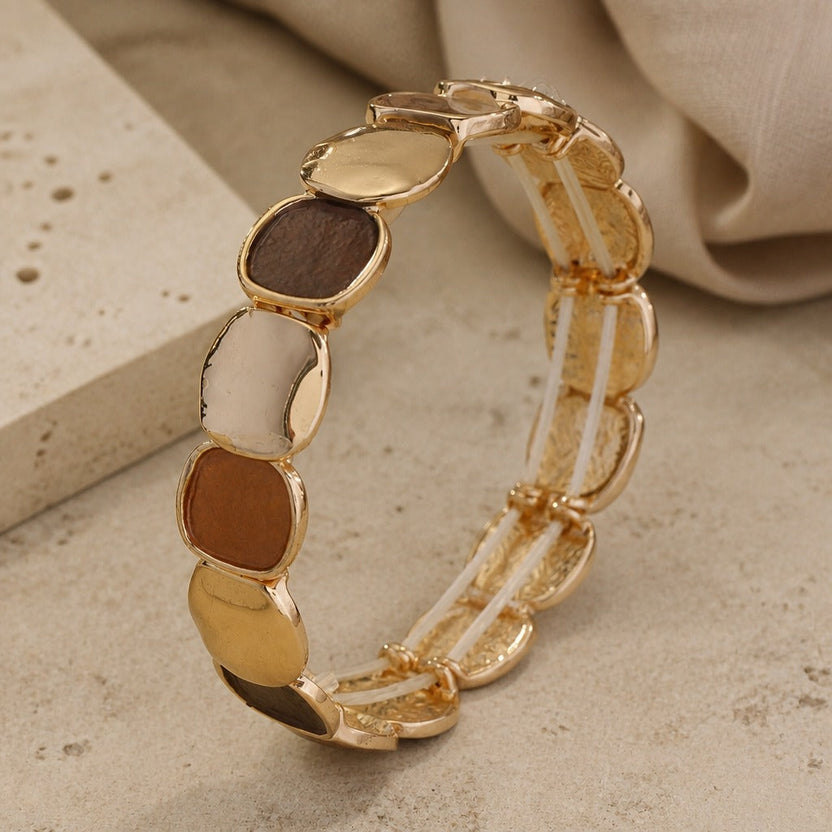 Pulsera artesanal elástica en dorado