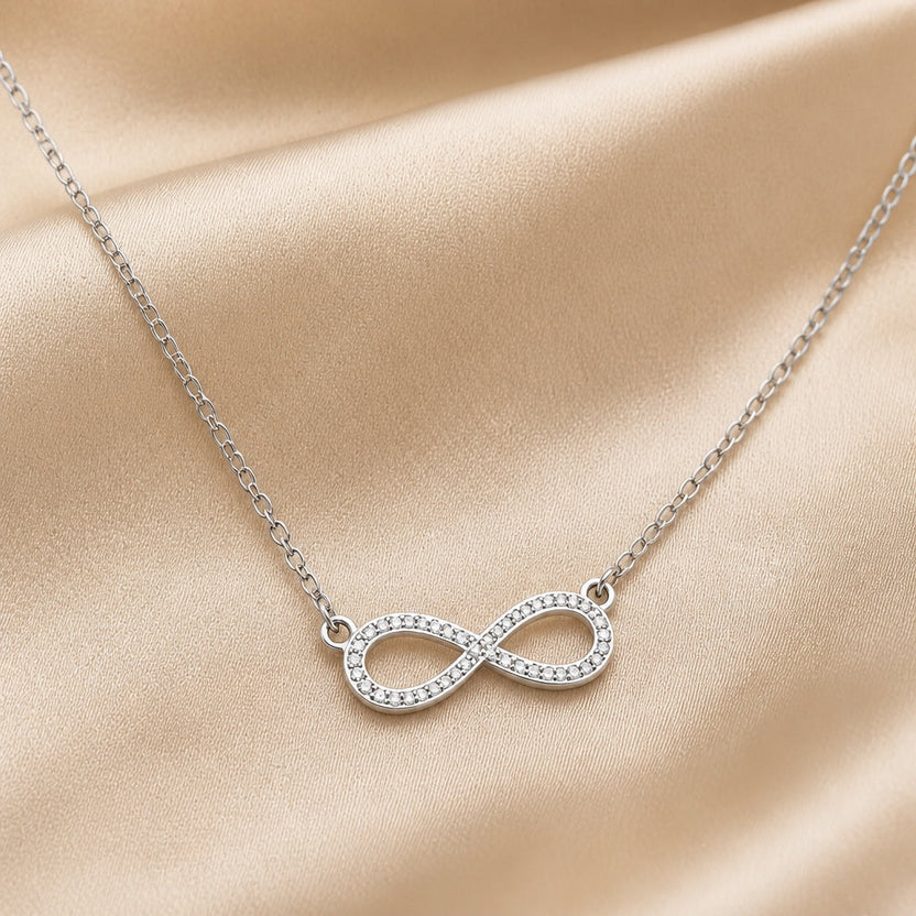 Collar colgante infinito de circonita y oro blanco