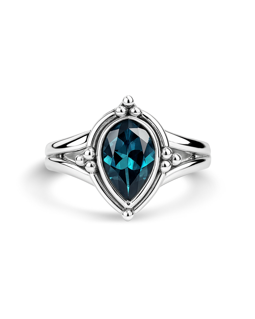 Anillo de topacio azul en forma de gota