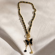 Collar colgante de mariposa con borla negra