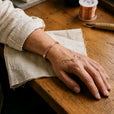 Pulsera de cordón con flor de cobre
