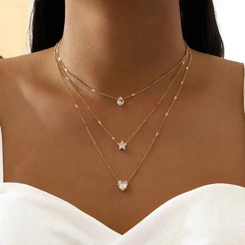 Collar de tres colgantes con circonita dorada