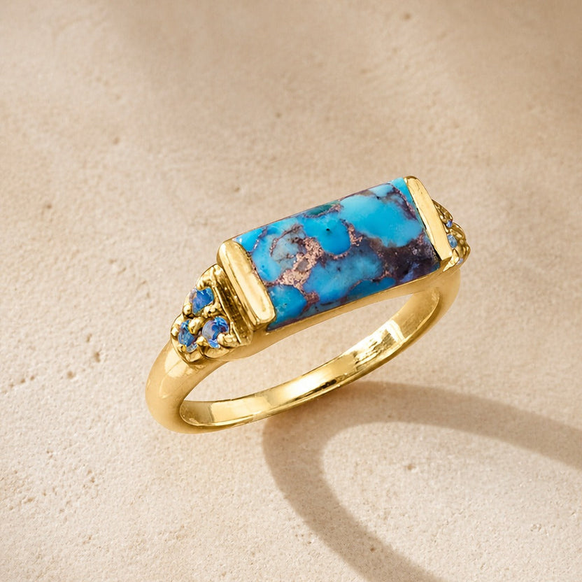 Anillo de cobre con incrustación de turquesa y baño de oro