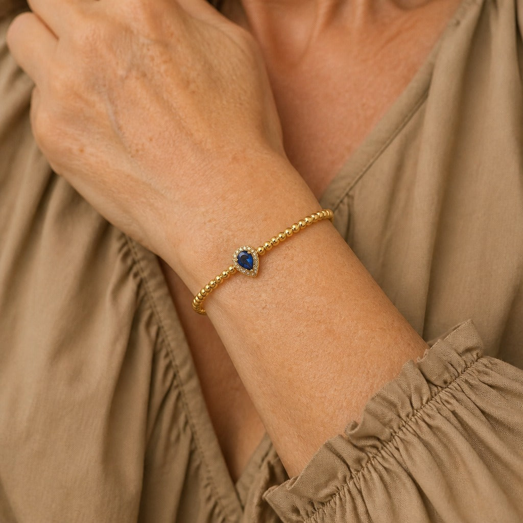 Pulsera manguito dorada de circonita con cristal