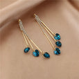 Pendientes elegantes de corazones de cristal azul en cascada