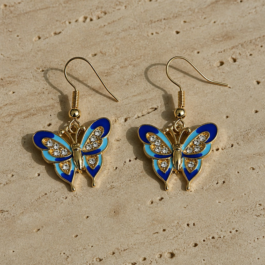Exquisitos pendientes de botón con mariposa