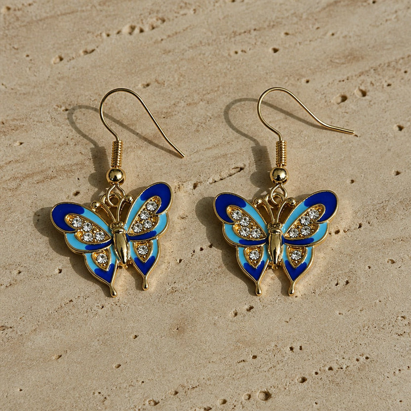 Exquisitos pendientes de botón con mariposa