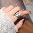 Anillo de plata envolvente con pluma