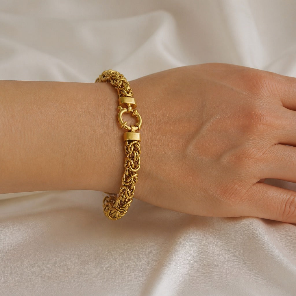 Pulsera dorada noble trenzada