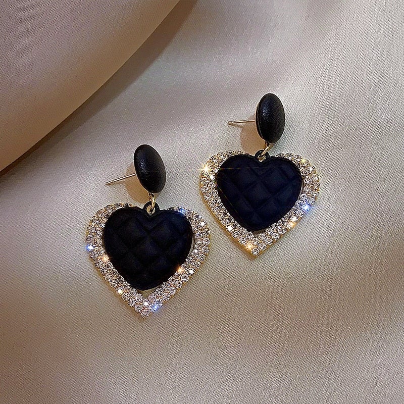 Pendientes de corazón en negro y oro