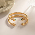 Brazalete dorado con gemas – imagen 6