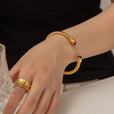 Brazalete dorado con gemas – imagen 11
