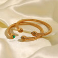 Brazalete dorado con gemas – imagen 9