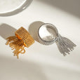 Anillo radiante con borla dorada – imagen 4