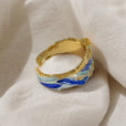 Anillo dorado con olas del océano – imagen 2
