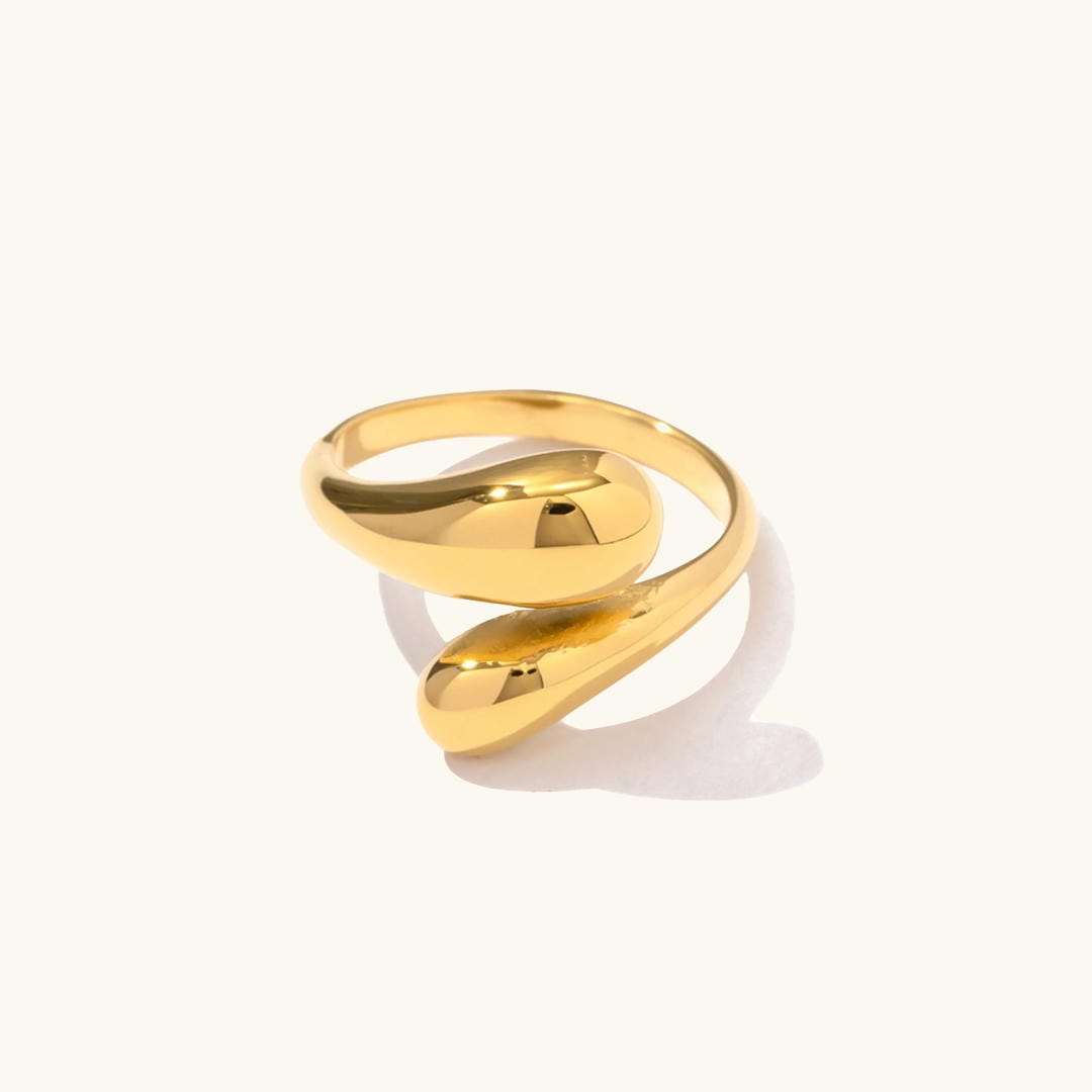 Anillo abierto radiante con gota
