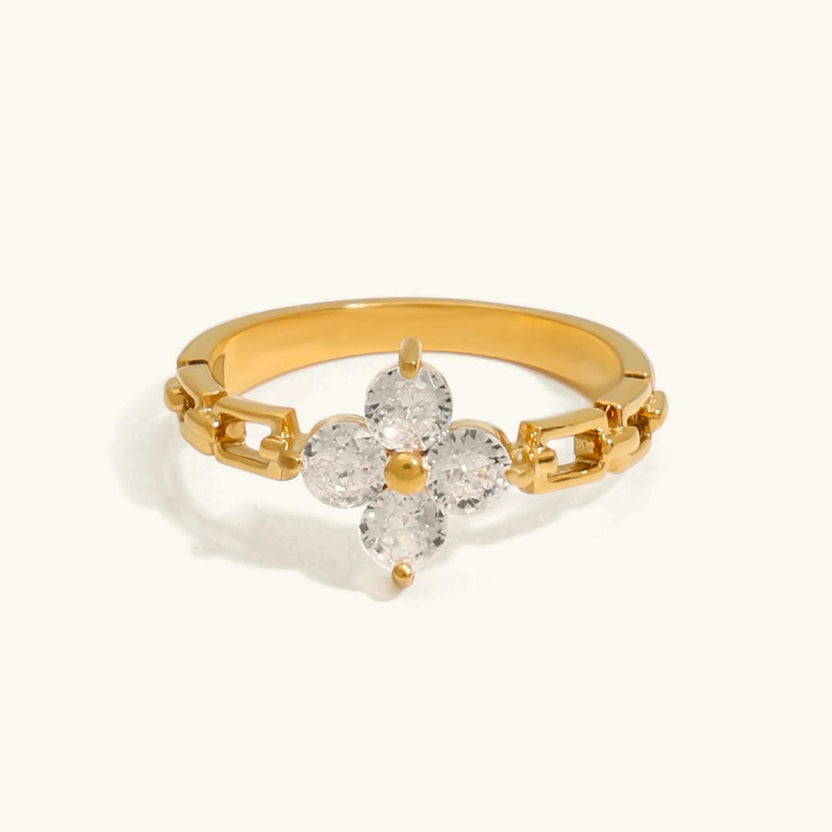 Anillo floral radiante con cristales