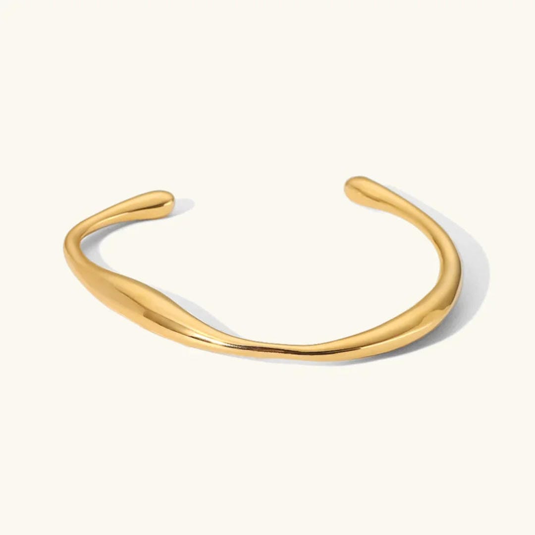 Brazalete espiral de lujo atemporal en dorado