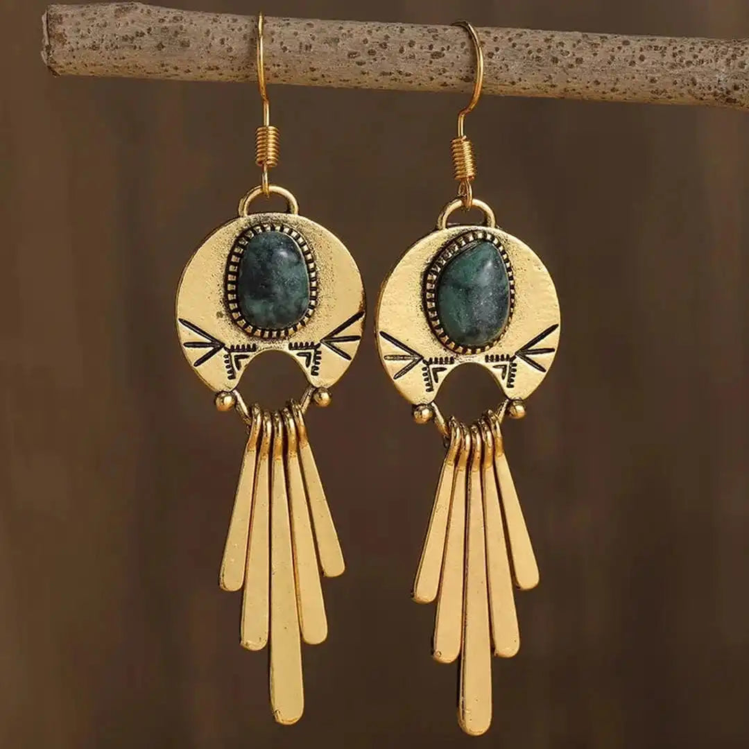 Pendientes boho dorados con disco y flecos