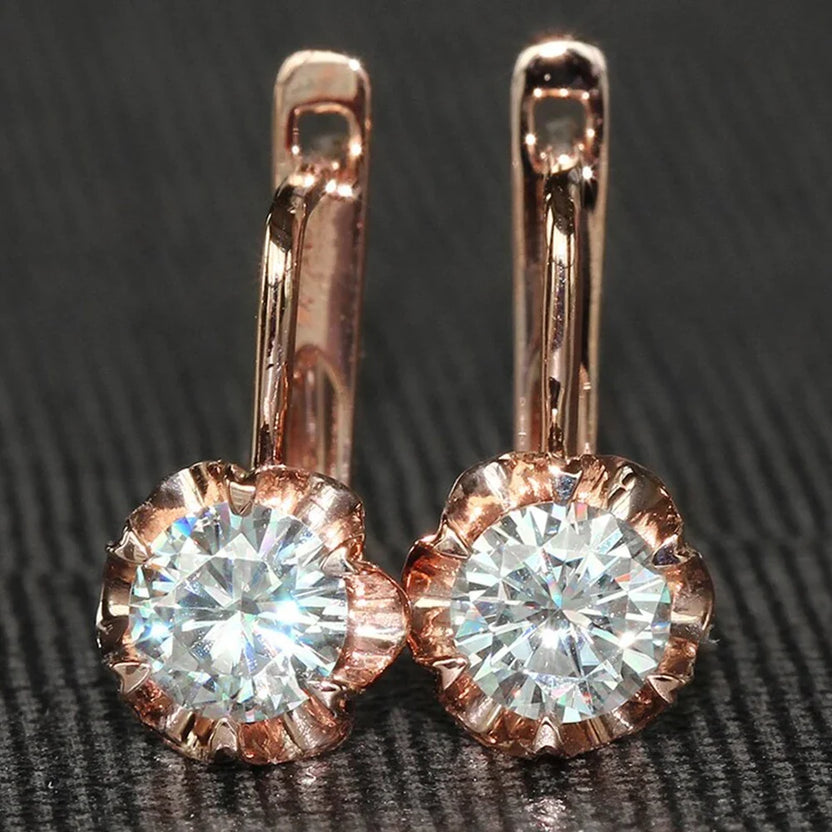 Pendientes elegantes de flores en oro rosa
