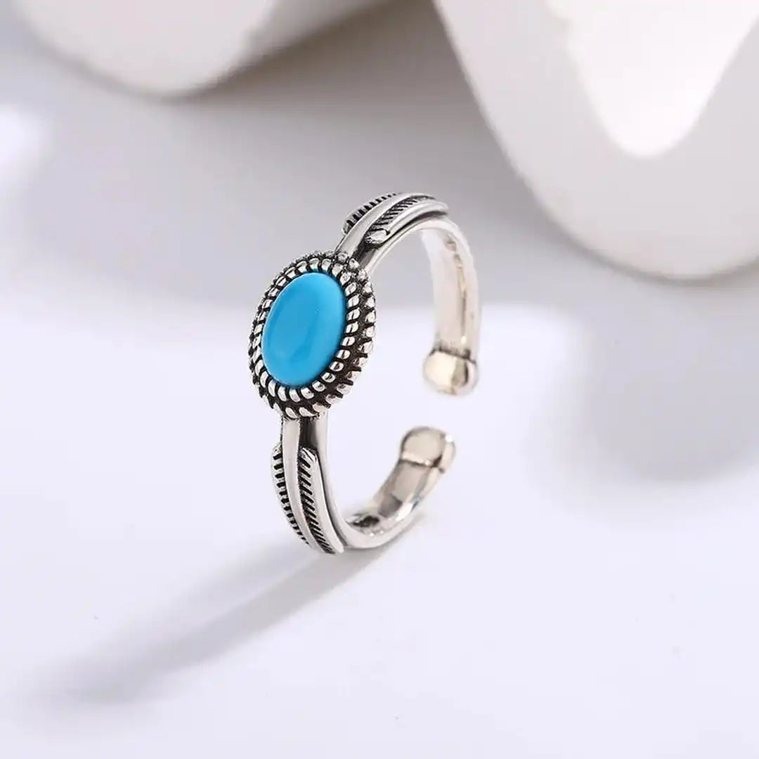 Anillo ajustable de plata con turquesa Feather
